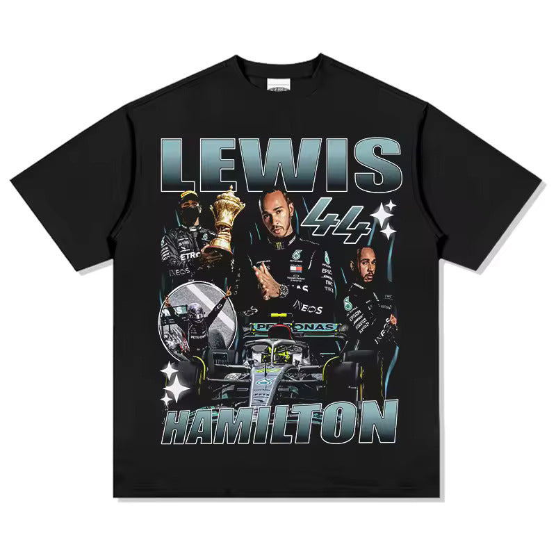 “Model wearing a Lewis Hamilton inspired loose box-fit t-shirt in a relaxed streetwear style. The t-shirt features bold, minimal race-inspired graphics on premium heavyweight cotton, with an oversized fit and dropped shoulders. Urban backdrop emphasizes a modern, confident look.”