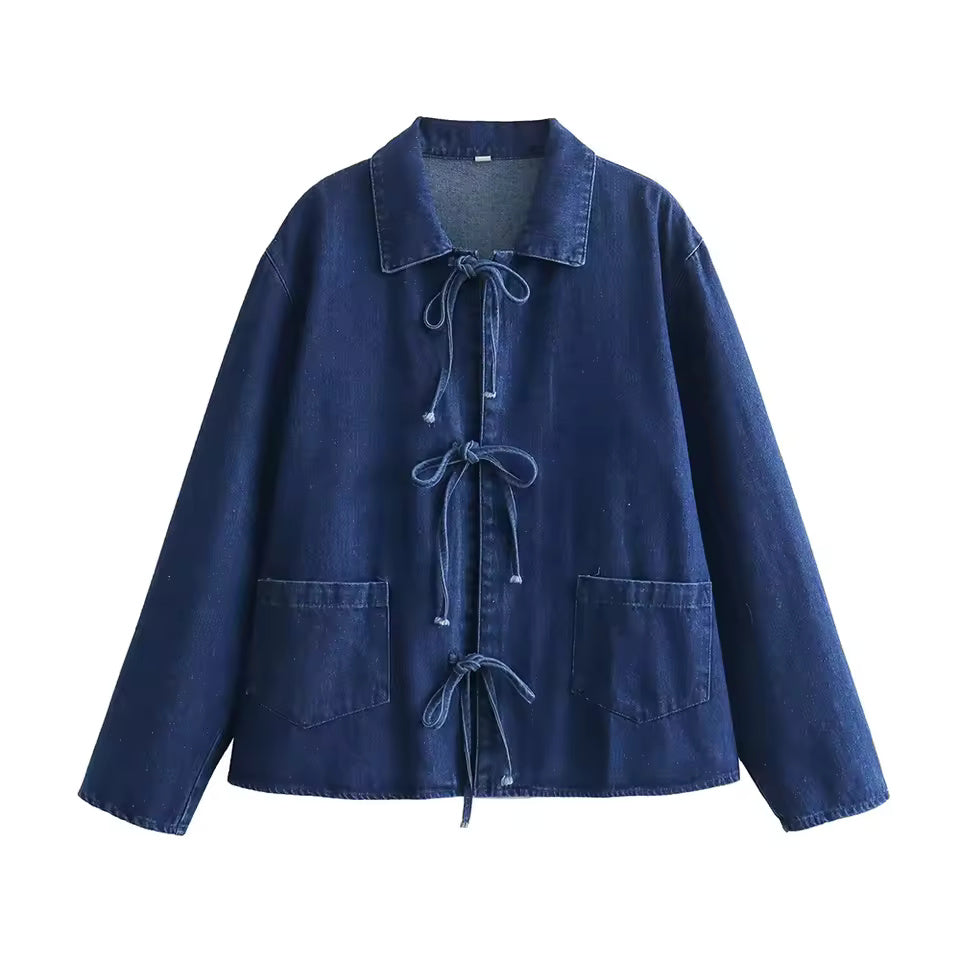 "Vintage-inspired denim blouse tie jacket featuring a button-down front, tie waist detail, and a relaxed fit for a timeless, versatile look."