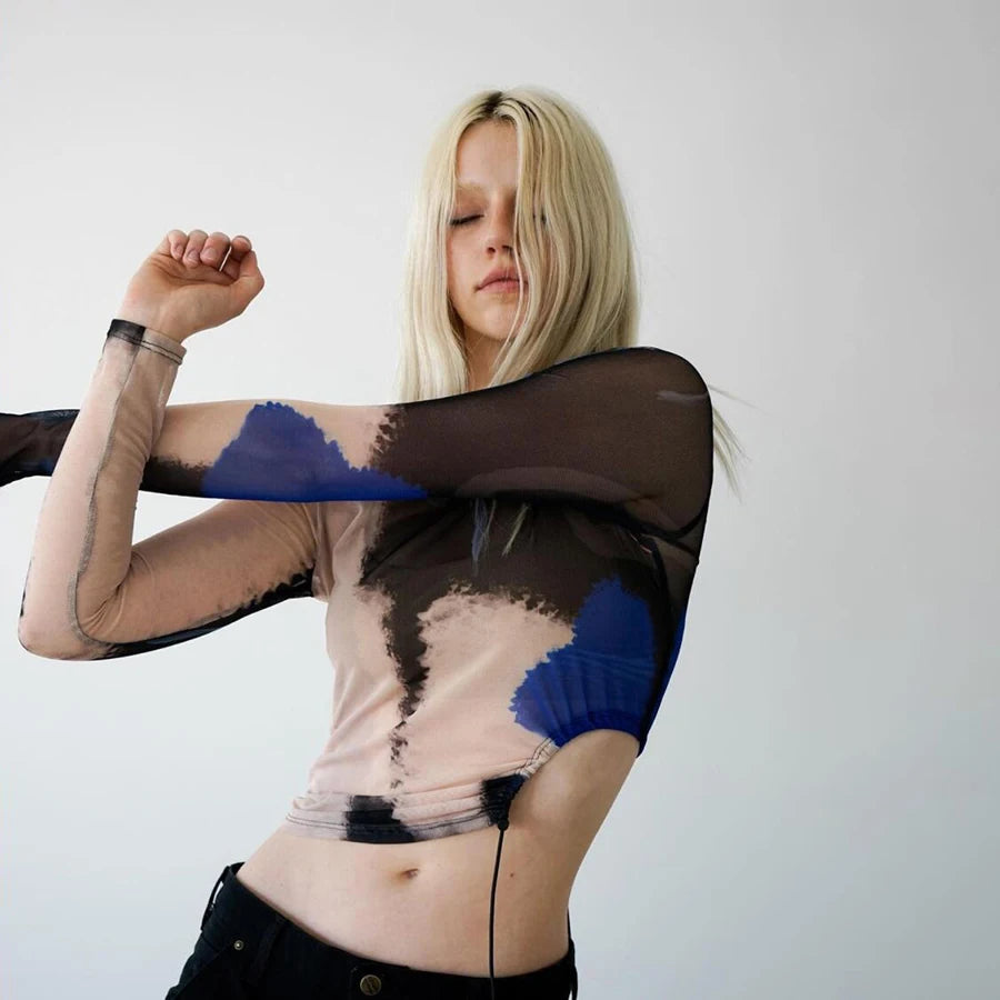 Tie Dye Art Prints Mesh O-Neck Tissue Top. Edgy and softer gothic style tattoo tissue top with high fashion tie dye abstract art print and asymmetric o-ring side cut with draw string details at the waist.