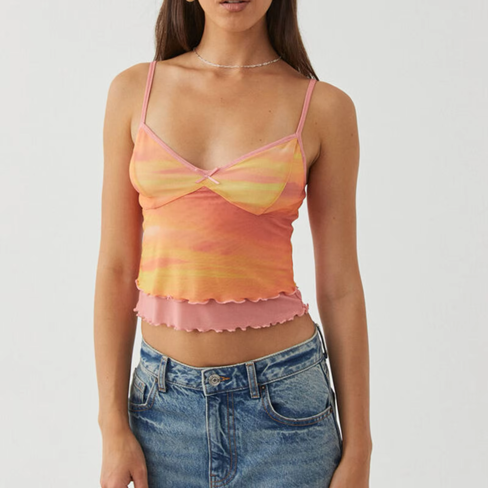 "Vibrant orange ombre print mesh cami with a gradual color fade, featuring spaghetti straps and a lightweight, breathable fabric, perfect for layering or wearing solo."