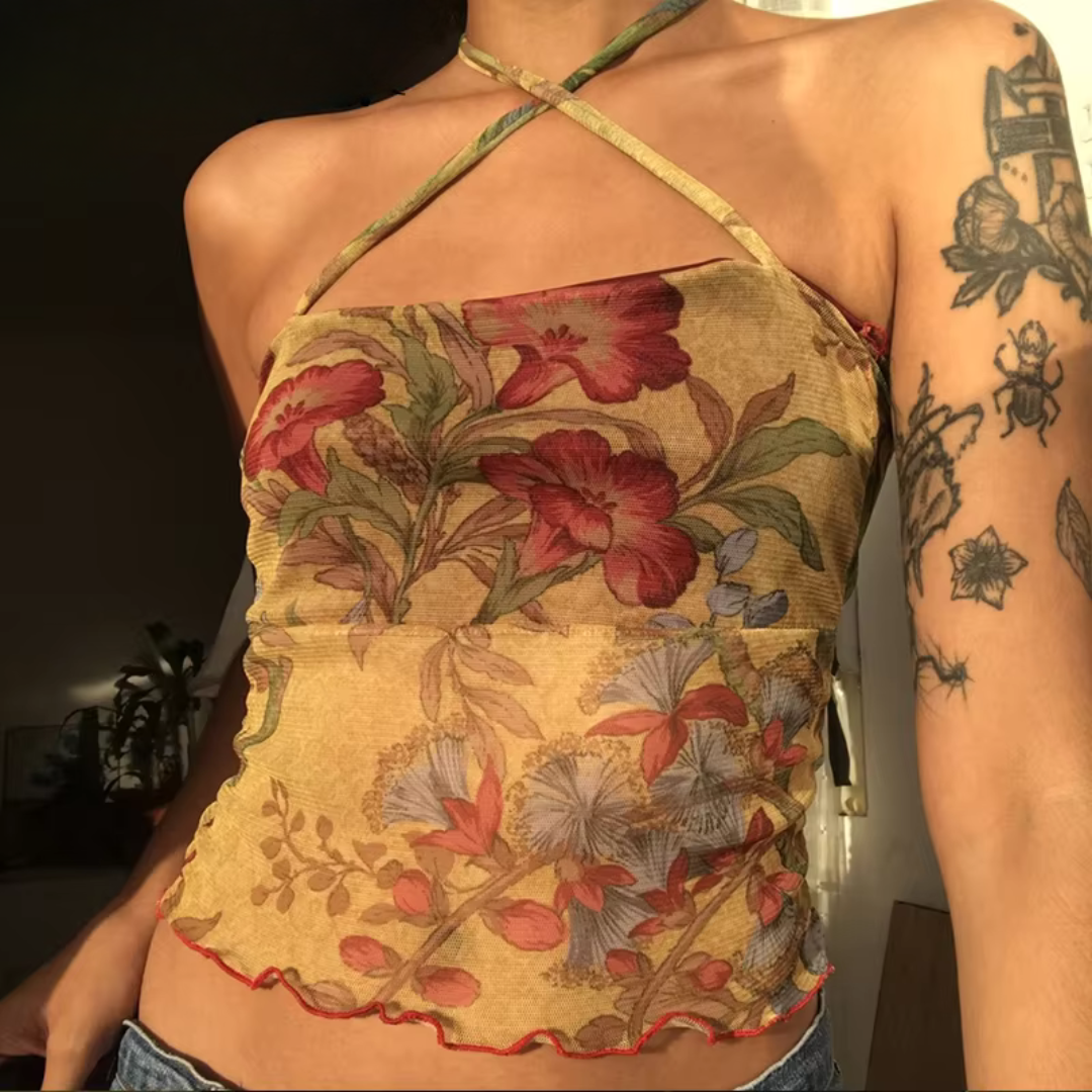 "Delicate vintage-inspired ruffle mesh halter top featuring soft ruffles along the neckline and hem, with a flattering halter neck design and lightweight, breathable fabric."